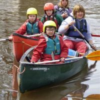 Canoeing on the canal - teamwork Canoeing on the canal - teamwork